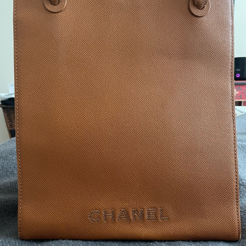 Chanel Bag. 2 deep pockets inside. Burnt orange /brown color. Authenticity card.